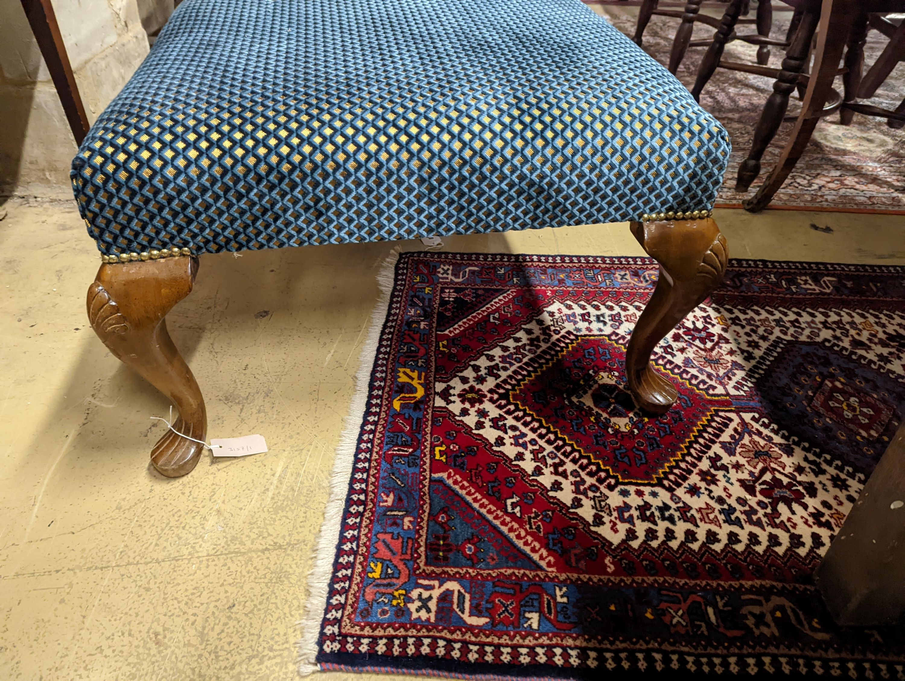 An upholstered footstool. W-117cm, D-73cm, H-44cm.